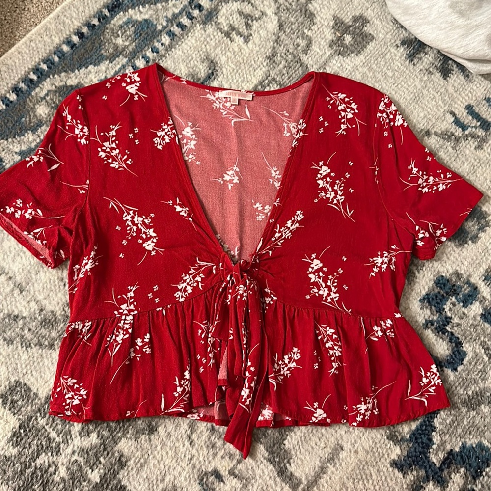 Lottie Moss red shirt